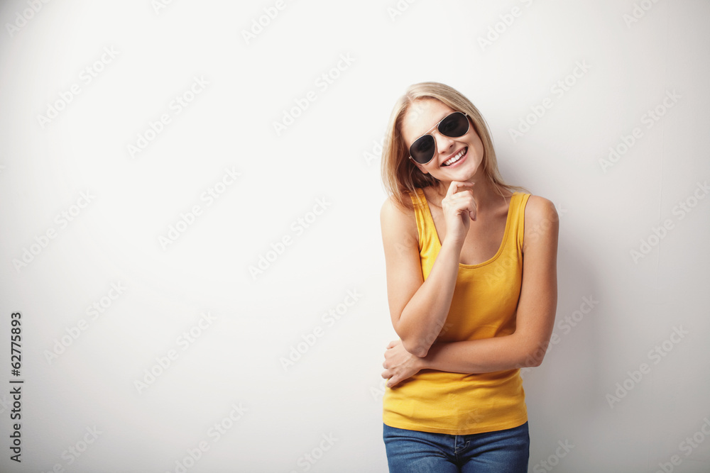 Young woman with yellow shirt and sunglasses