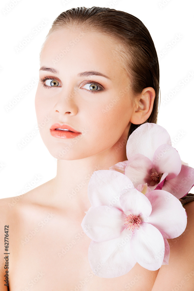 Woman with healthy clean skin and pink flowers Woman with healthy clean skin and pink flowers