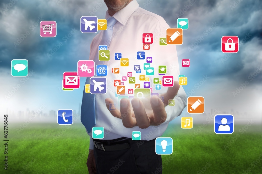 Businessman presenting app icons Businessman presenting app icons