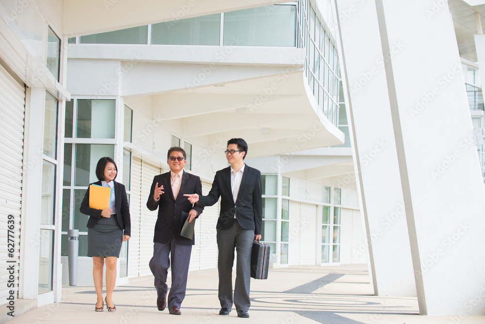 asian business team walking in office background asian business team walking in office background
