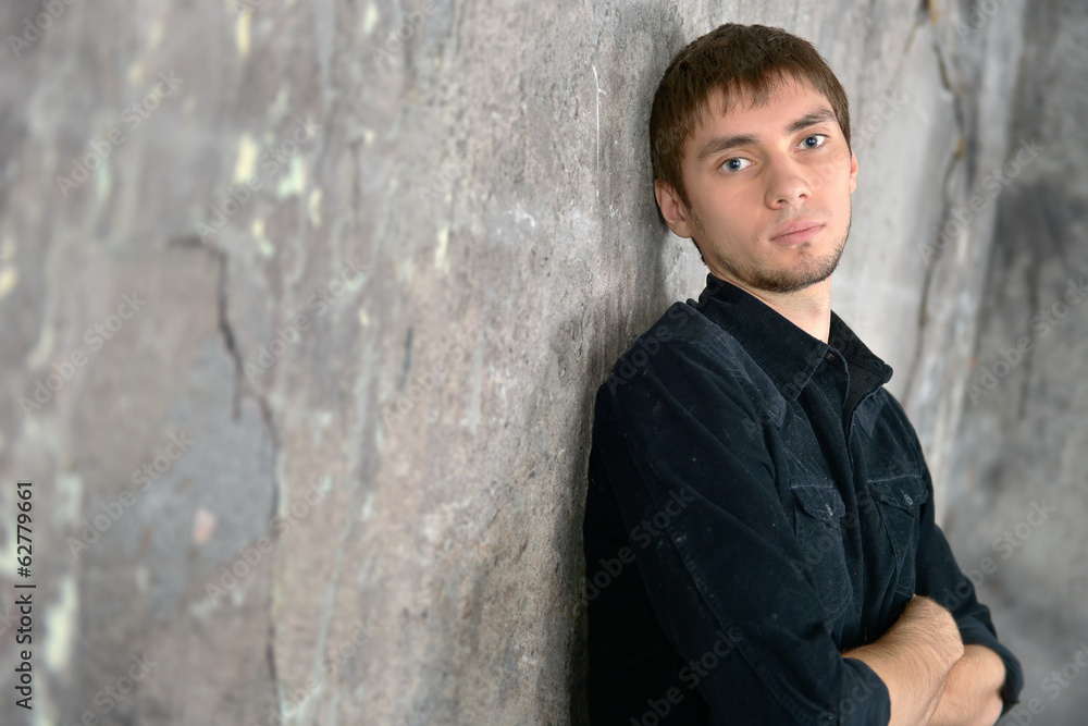 Young handsome man against wall Young handsome man against wall
