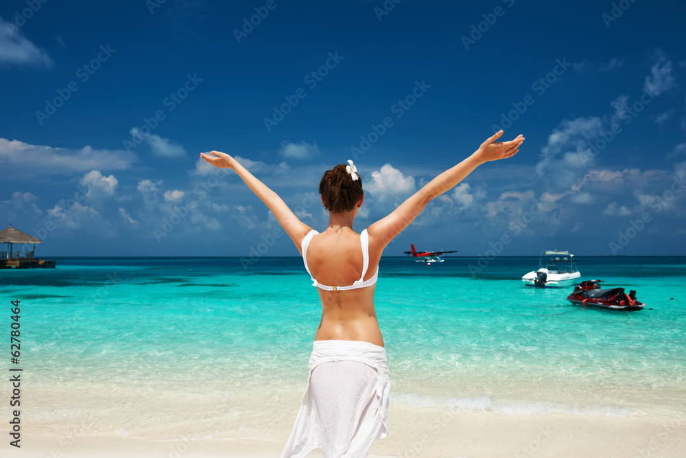 Woman at beach. Seaplane at background. Woman at beach. Seaplane at background.