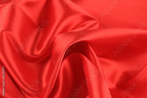 Close up of red silk fabric background.