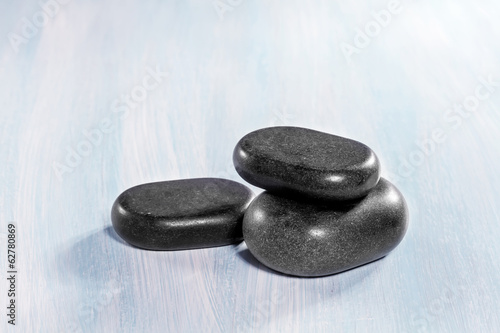 Zen stones on a wooden background