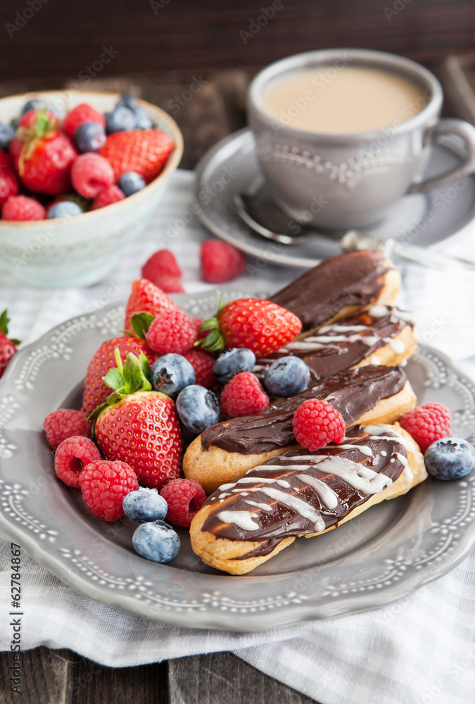 Chocolate eclairs with fresh berries Chocolate eclairs with fresh berries