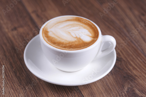 Fototapeta Naklejka Na Ścianę i Meble -  Cup of coffee on a wooden table