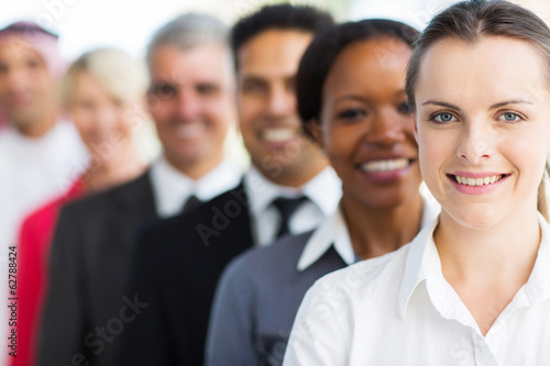businesswoman with colleagues standing in a row