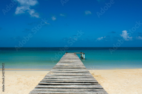 Pier on a tropical beach - Porticciolo su spiaggia caraibica © Jef Milano