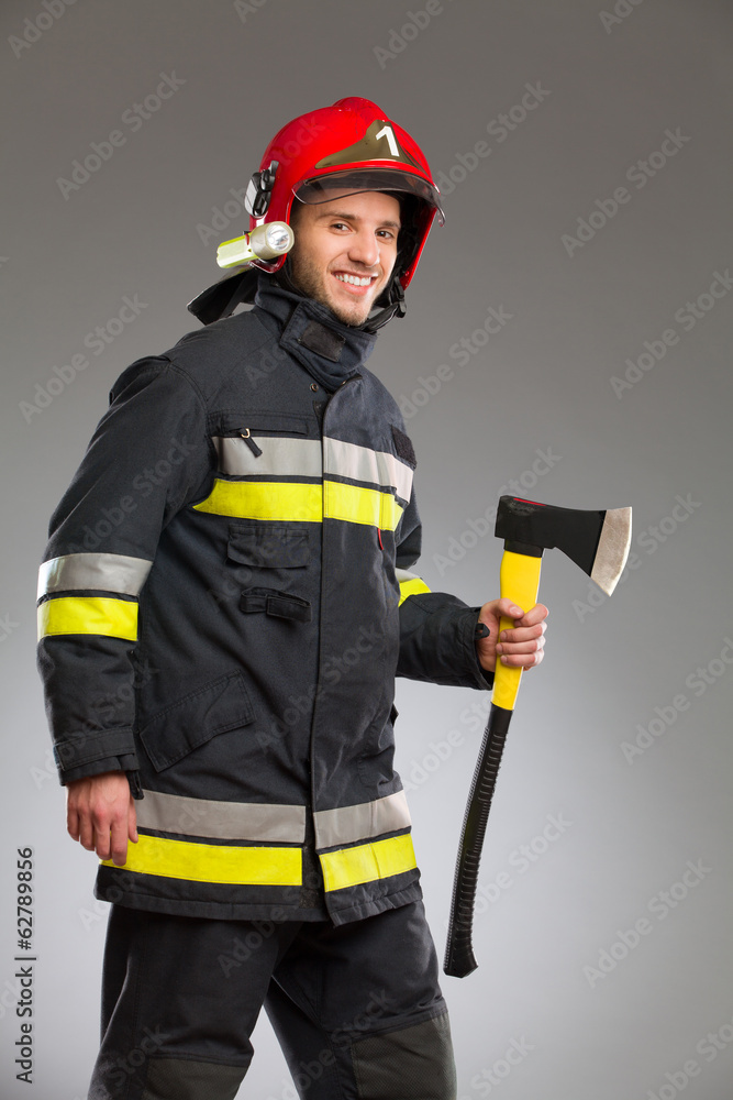 Fireman posing with axe. Fireman posing with axe.