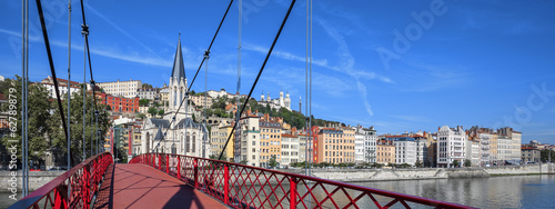 Lyon city with red footbridge on Saone river