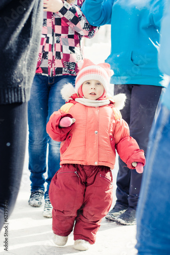 Small child lost in a crowd of strangers