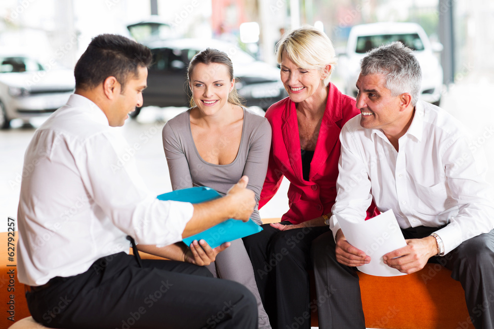 indian car dealer explaining sales contract indian car dealer explaining sales contract