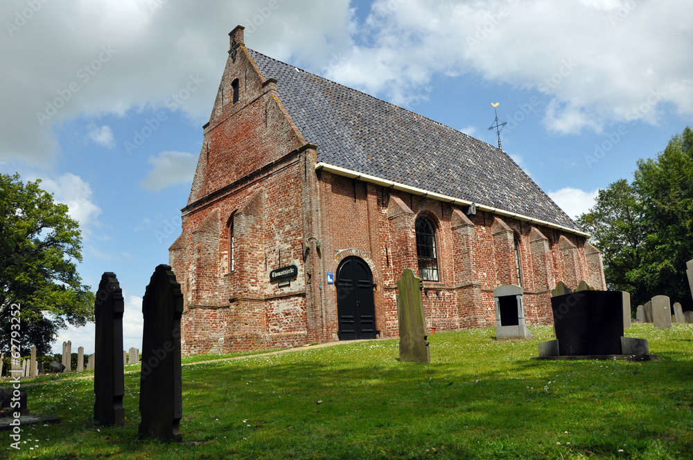 A small old protestant church gothic style  in Dutch Friesland