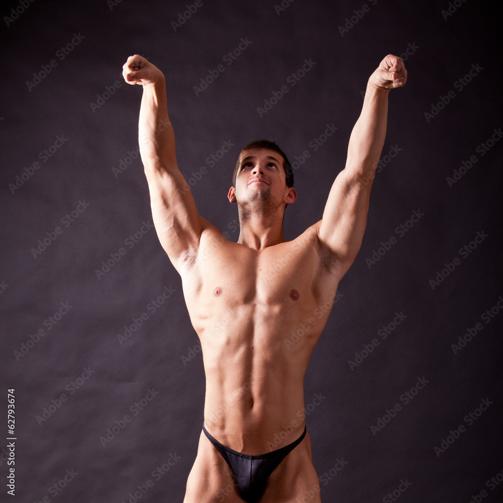 Naklejka premium young bodybuilder posing