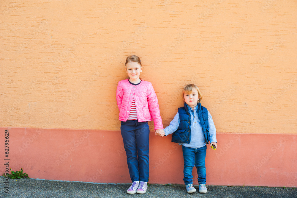 Outdoor portrait of two adorable children