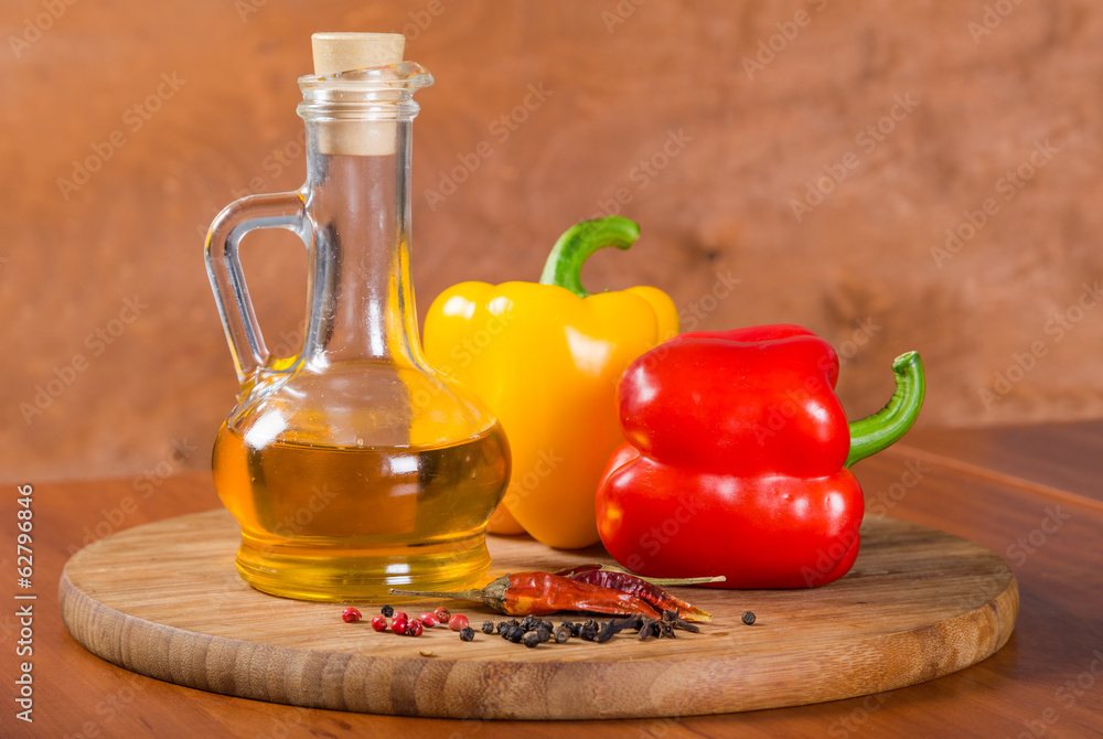 Peppers and oil on cutting board Peppers and oil on cutting board