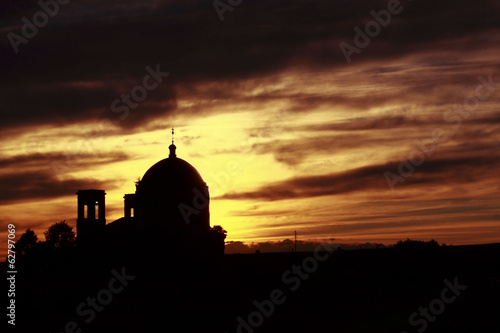 Christian temple silhouette at sunset