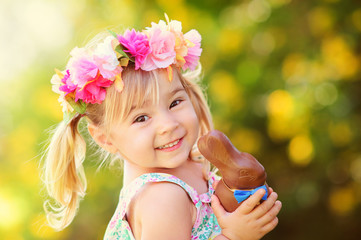 cute easter girl with chocolate bunny