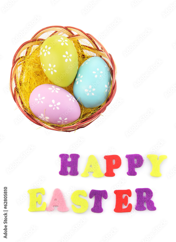 Easter eggs in nest and Happy Easter sign, isolated on white