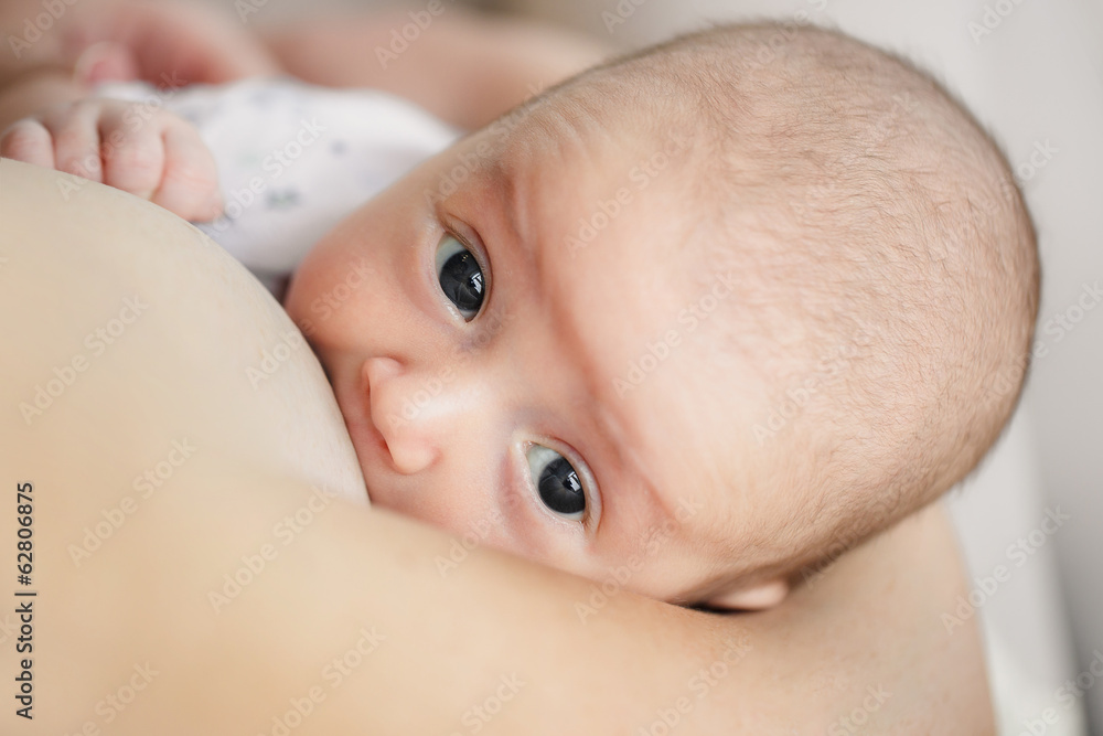 portrait of Mother breast feeding her infant baby portrait of Mother breast feeding her infant baby