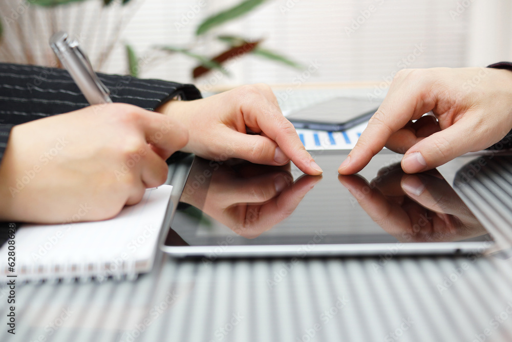 Fototapeta premium woman and man working with digital tablet on business meeting in