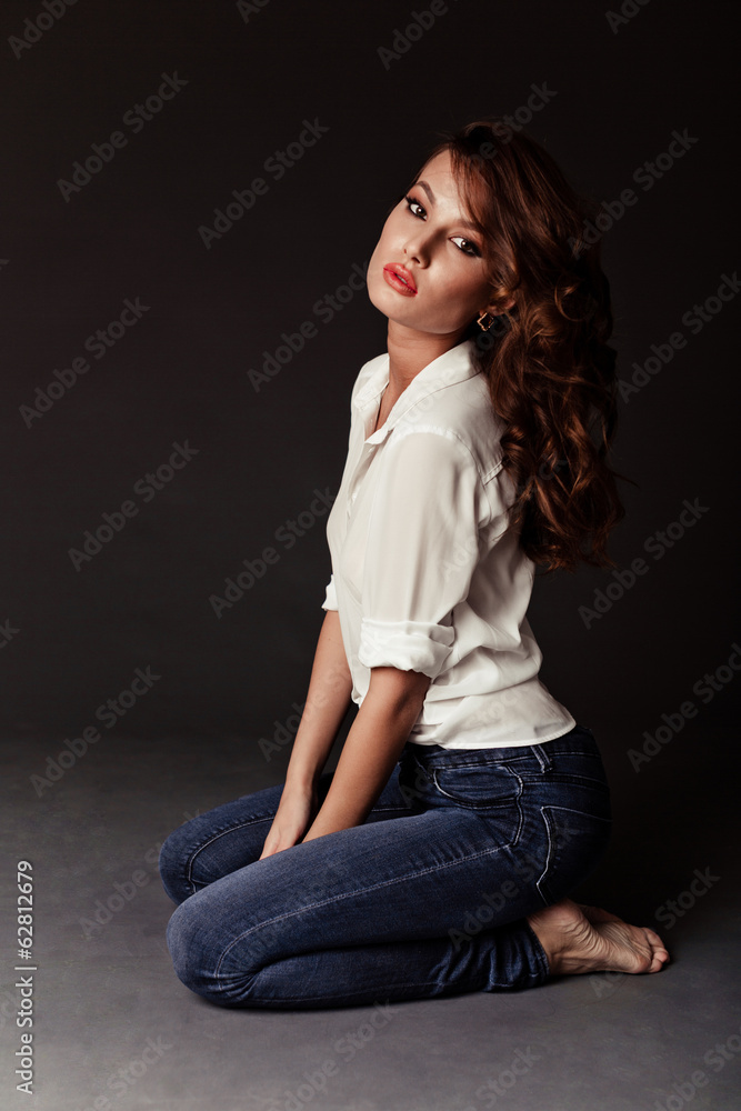 Lovely woman in white blouse and blue jeans Lovely woman in white blouse and blue jeans