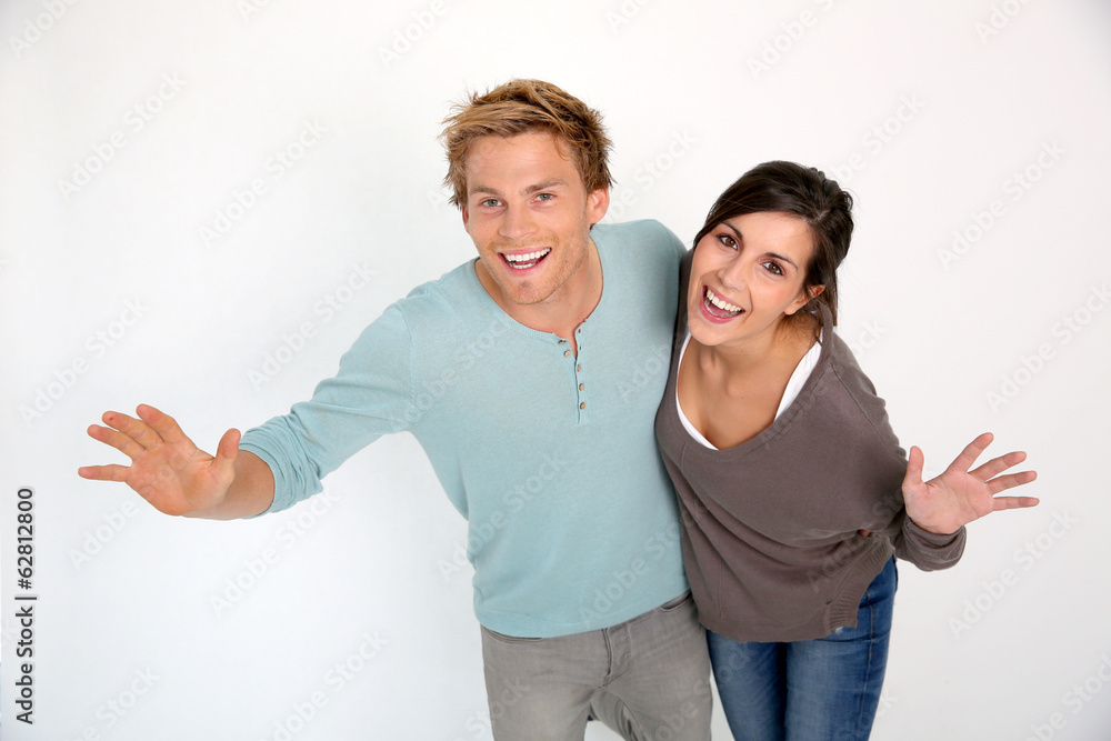 Cheerful couple on white background laughing outloud Cheerful couple on white background laughing outloud