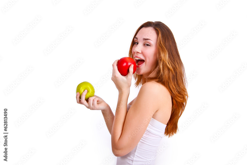 Attractive girl eating apples on a white background Attractive girl eating apples on a white background