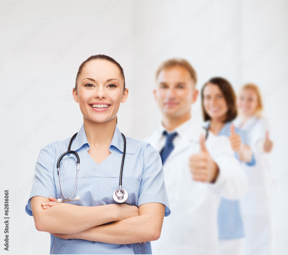 smiling female doctor or nurse with stethoscope smiling female doctor or nurse with stethoscope