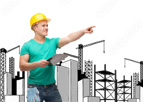 smiling man in helmet with clipboard photo