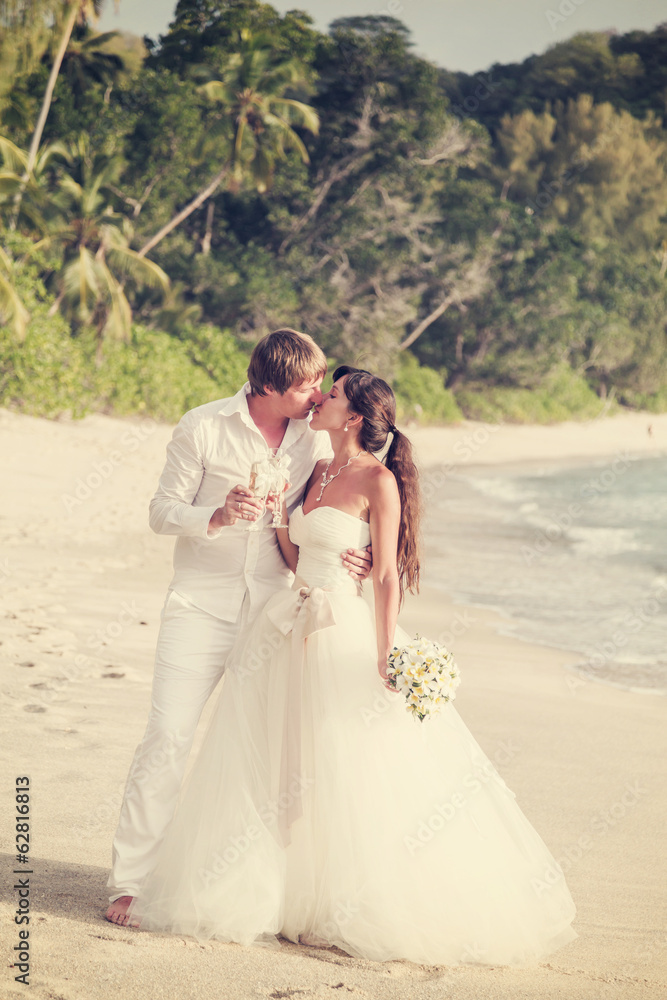 newlyweds with wedding bouquet newlyweds with wedding bouquet