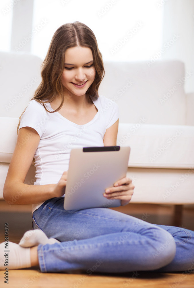 smiling teenage girl with tablet pc at home smiling teenage girl with tablet pc at home