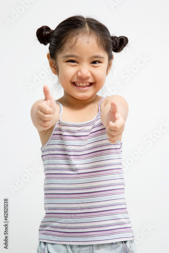 Pretty confident girl showing thumbs up isolated one white