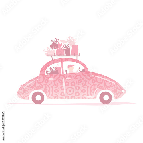 Man driving pink car with gifts on roof