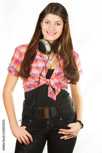 beautiful girl in headsets in the studio of the audio recording
