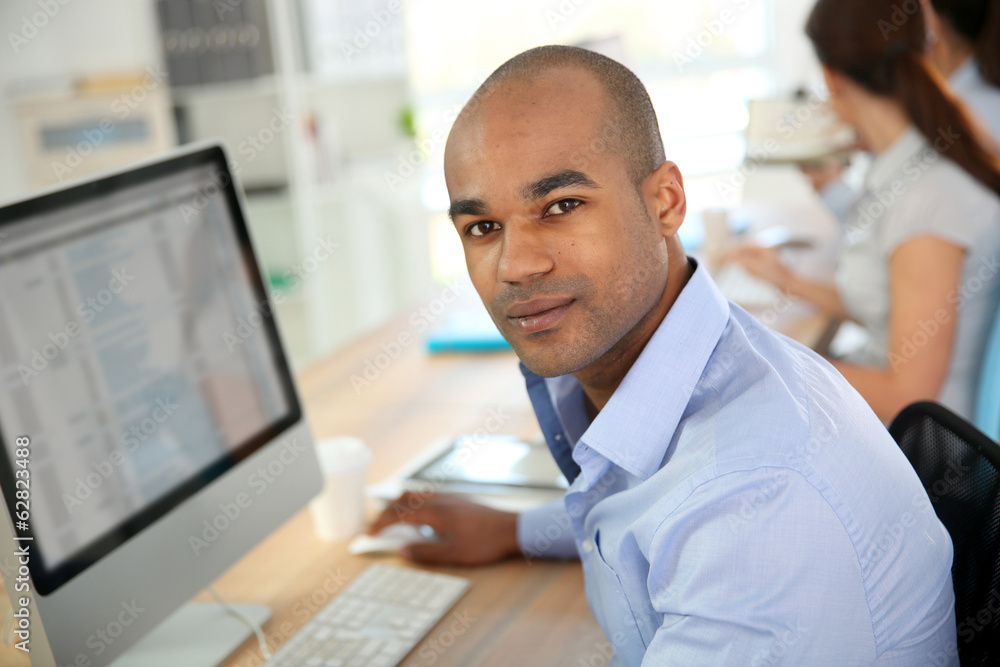 Portrait of young businessman in office Portrait of young businessman in office