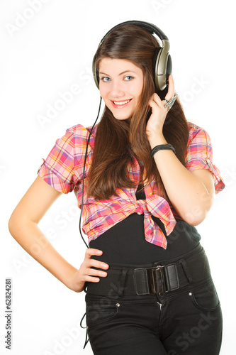a beautiful girl listens music in headsets