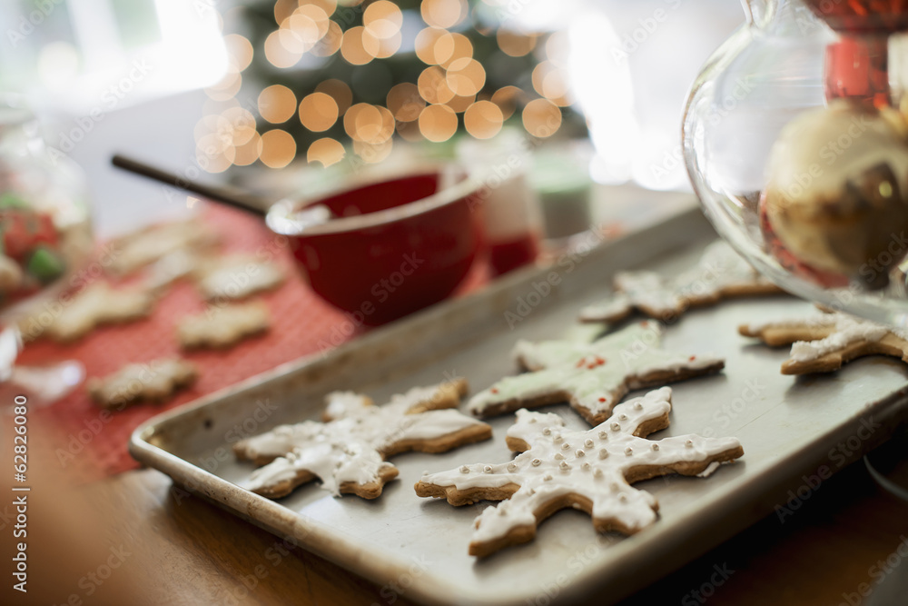 Baking tray of organic homemade Christmas cookies in the shapes of icicles and stars. Baking tray of organic homemade Christmas cookies in the shapes of icicles and stars.