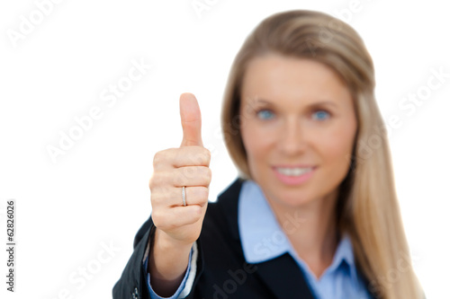 Smiling business woman showing thumbs up sign