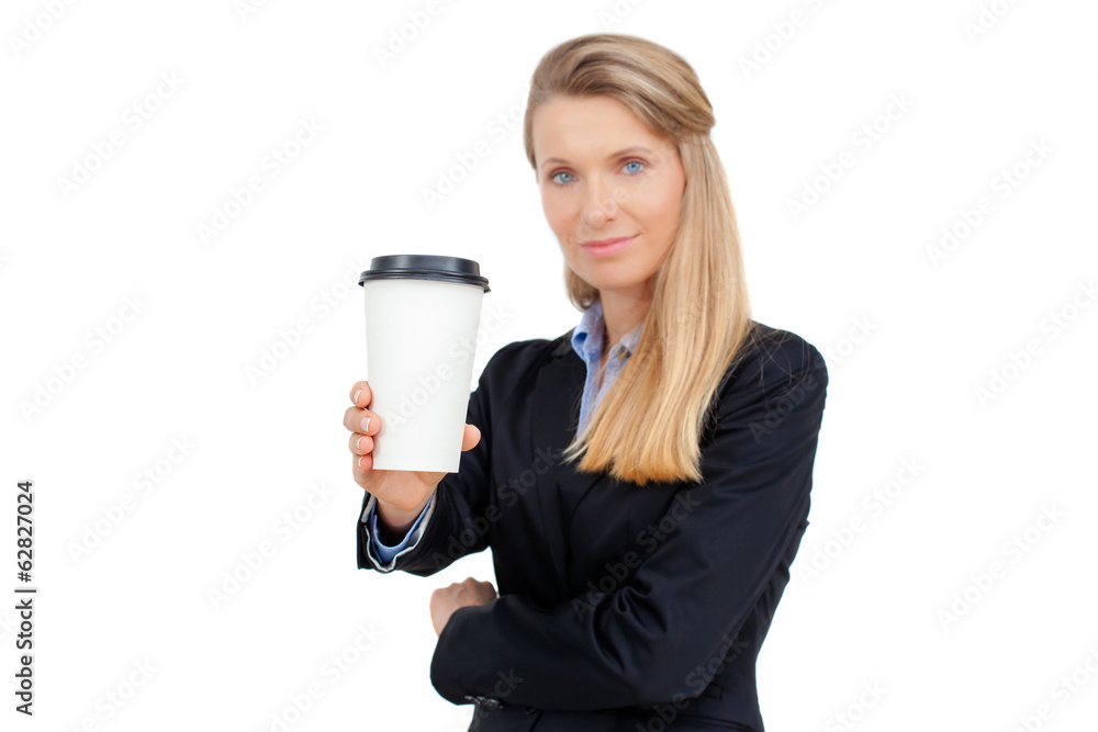 Beautiful blond young businesswoman holding a cup of coffee Beautiful blond young businesswoman holding a cup of coffee