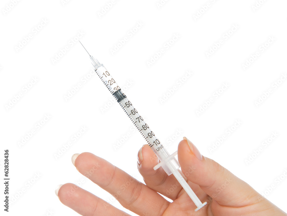 Doctor hand with medical insulin syringe ready for injection Doctor hand with medical insulin syringe ready for injection