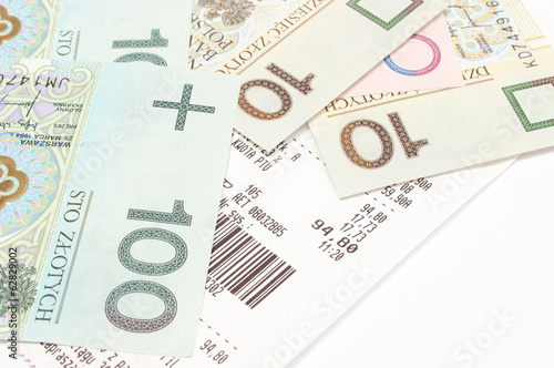Closeup of money with receipt on white background