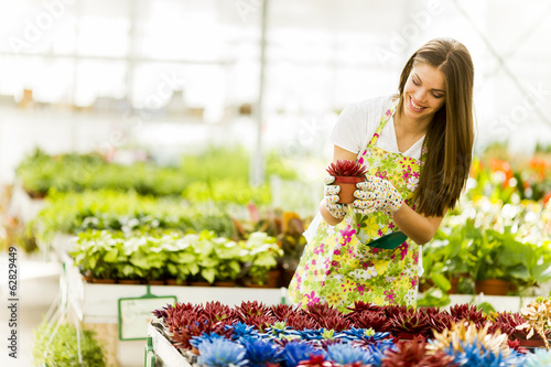 Young woman in flower garden