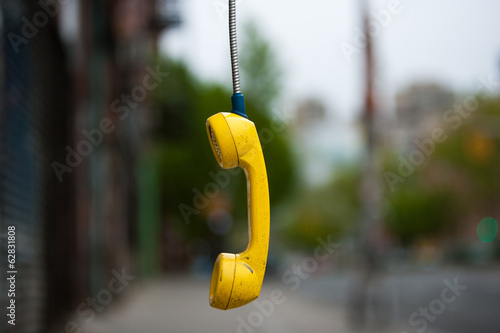 Streets of New York City. USA. An abandoned telephone receiver.  photo