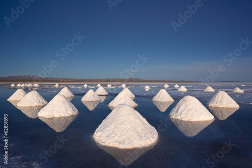 Piles of salt dry in the arid atmosphere of Bolivia's Salar de Uyuni. photo