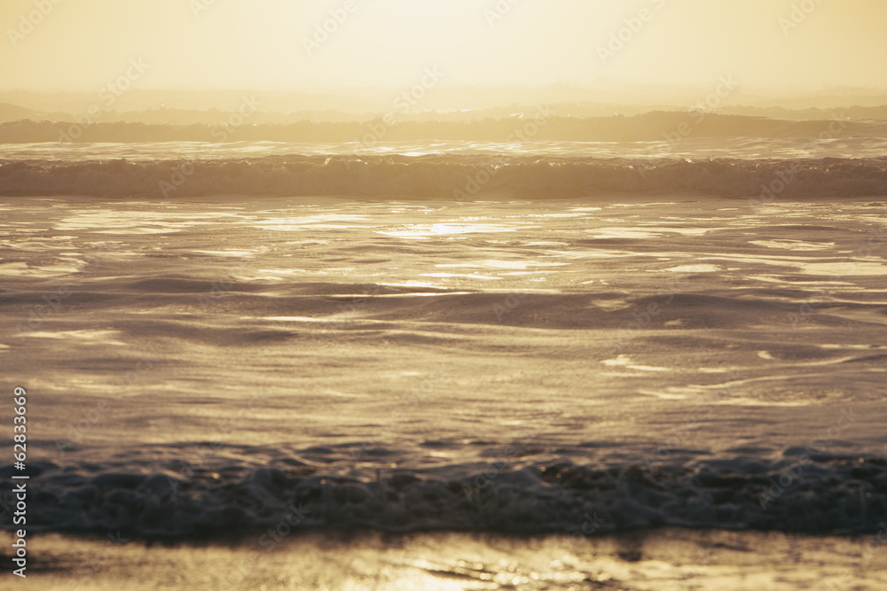 Seascape at dusk, Waves breaking on the shore. Tidal zone. Off the shores of the Olympic National park, in Washington, USA Seascape at dusk, Waves breaking on the shore. Tidal zone. Off the shores of the Olympic National park, in Washington, USA
