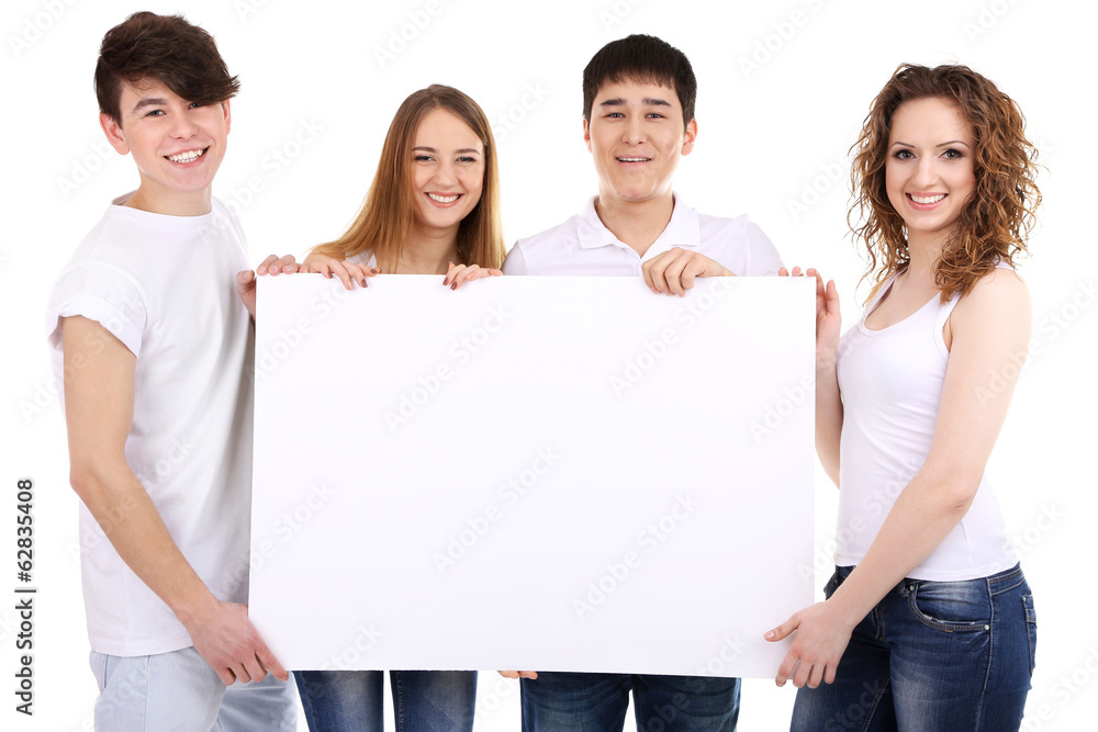Group of happy young people holding blank poster isolated Group of happy young people holding blank poster isolated
