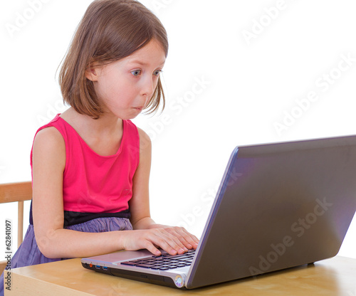  girl sitting at a laptop.