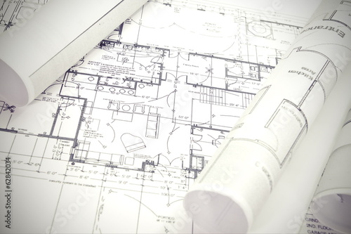 Architect rolls and plans architectural plan