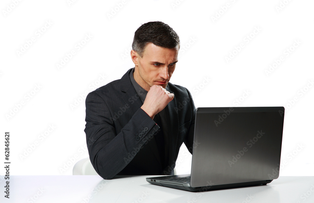Confident businessman sitting at the table Confident businessman sitting at the table
